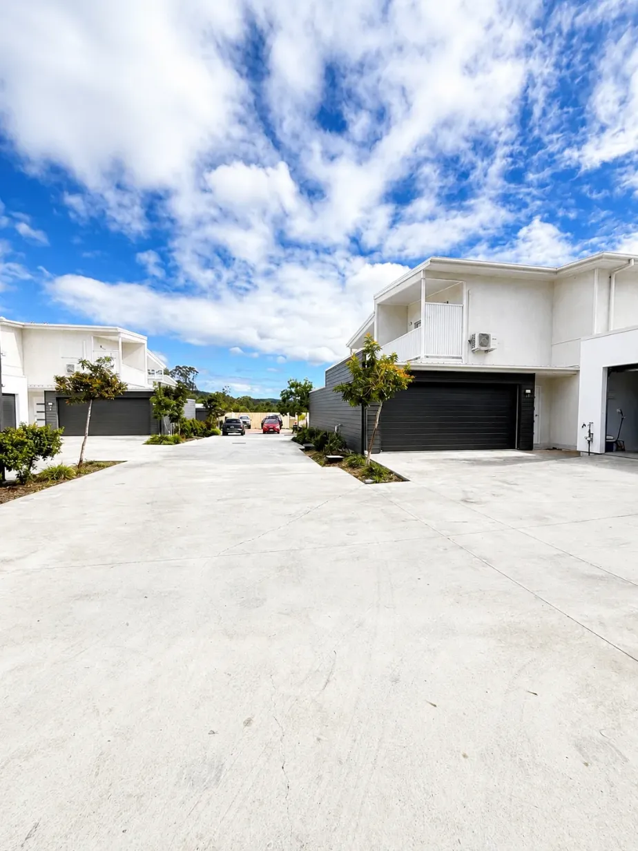 Two-storey Pimpama townhouse for sale with double garage, balcony and shared driveway